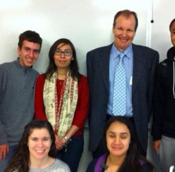Munoz and Ireland with a mixed group of high school students
                  