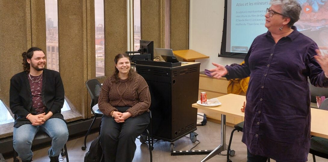 French majors Rica and Eliza, with French faculty member Ellen McClure, at the Spring 2024 French Undergraduate Student Showcase